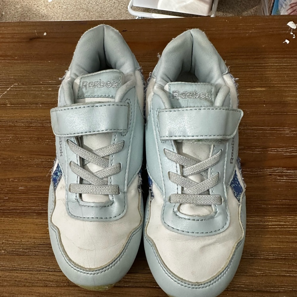 Little girls 12 Reebok Velcro sneaker . Light blue /blue sparkle.  Used .